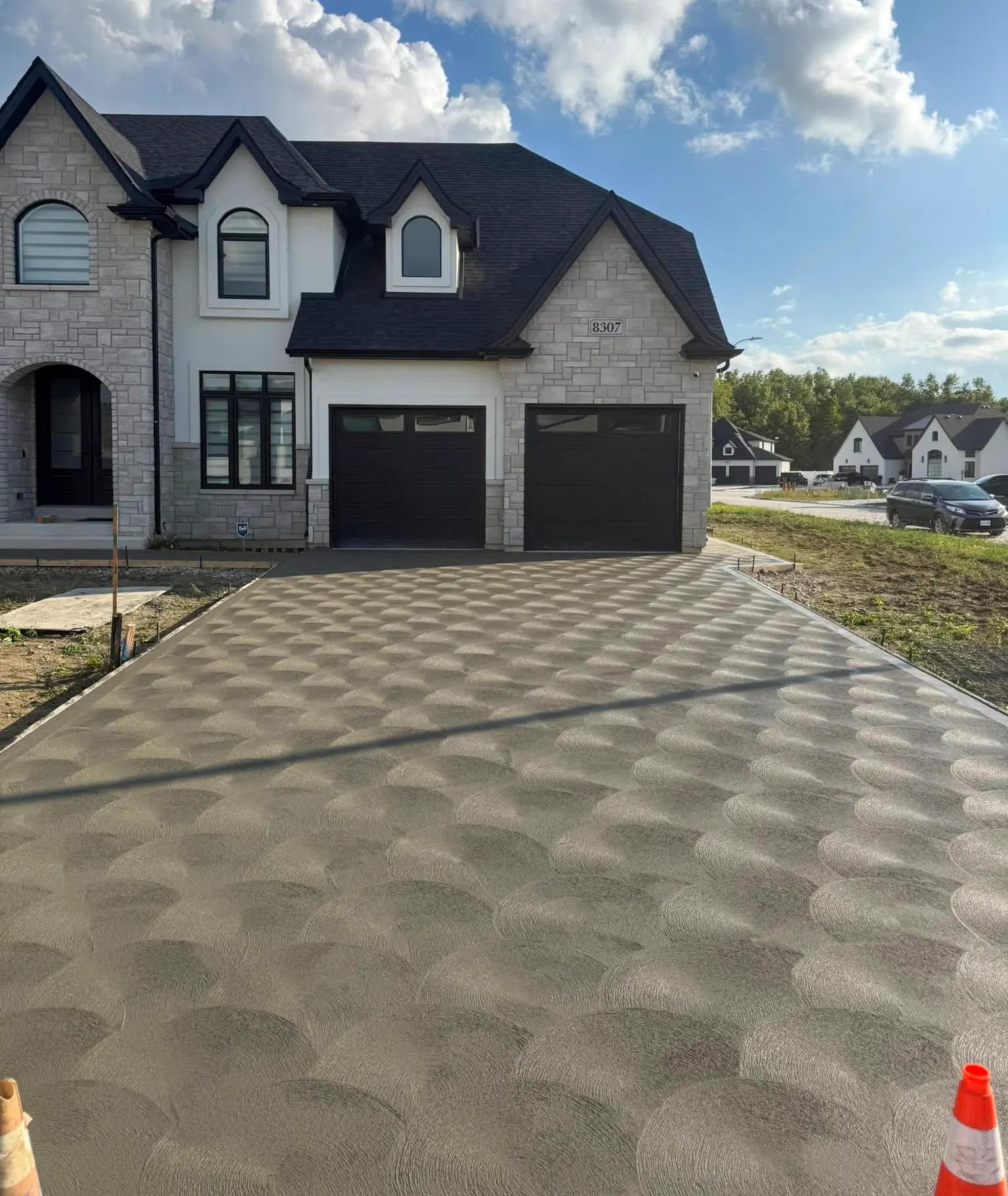 Completed concrete driveway with rosette spin finish in Windsor